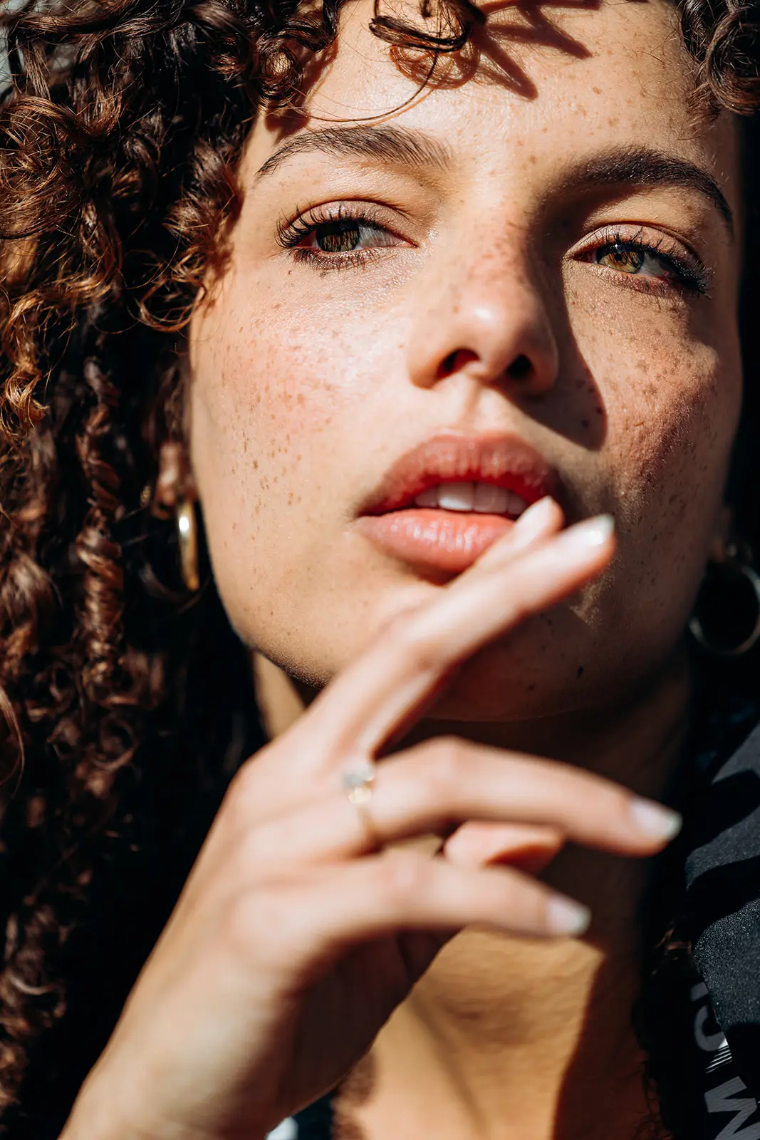 Close-up actor portfolio headshot of a woman photographed outdoors in Brooklyn, New York.
