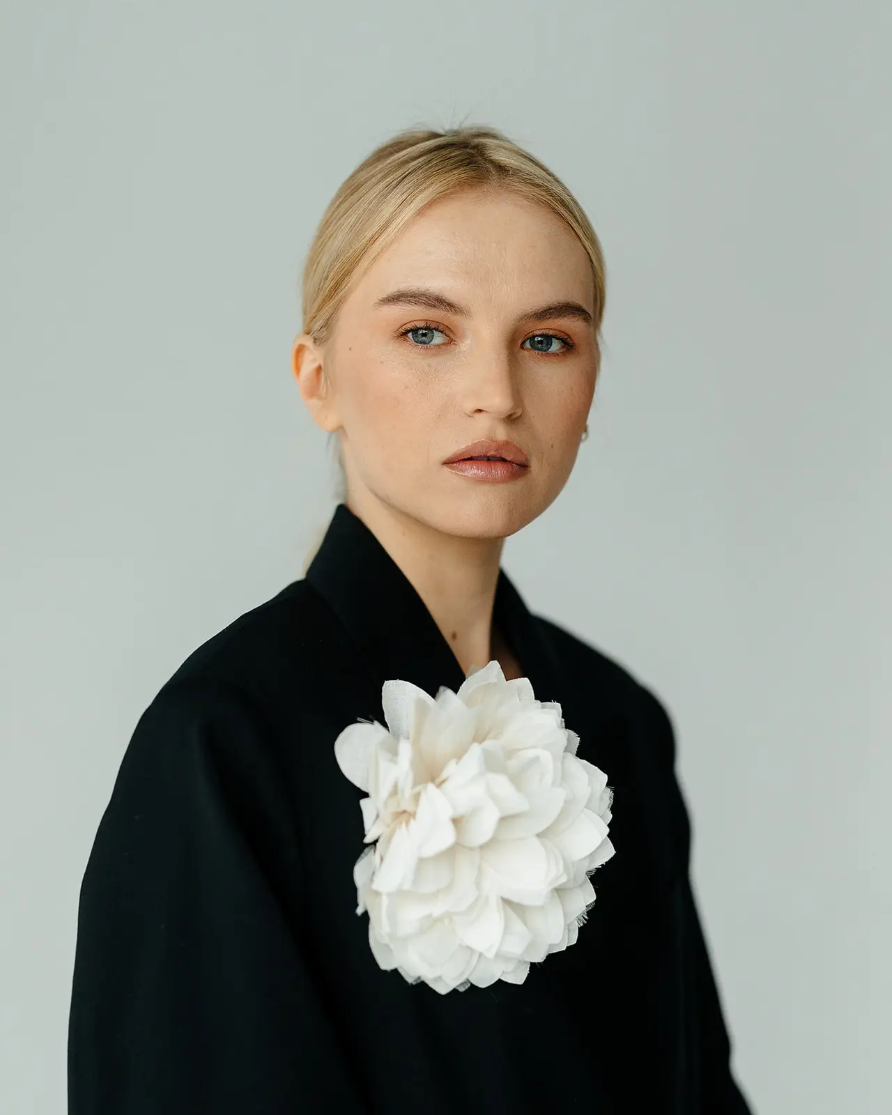 Female model headshot in a black blazer photographed during a professional model test session in New York City.